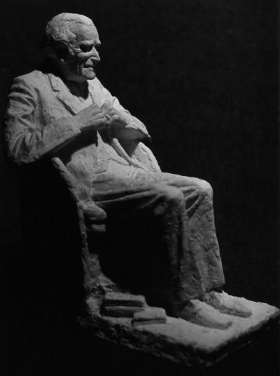 Sir Geoffrey Keynes seated